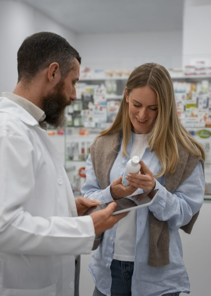 Male Pharmacist Consulting Female Customer